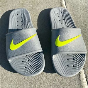 Slightly used Nike mens gray slides